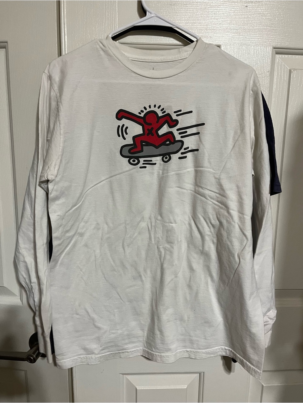 Nike White Long-Sleeve Tee with Red Skate Graphic
17-09